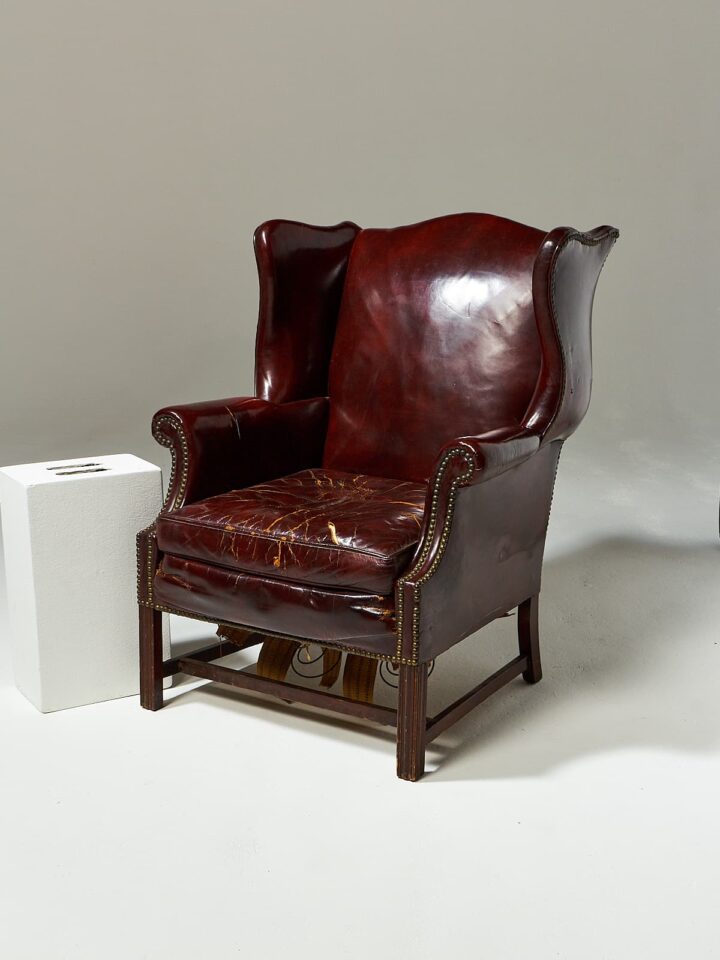 CH520 Harold Distressed Leather Wingback Chair Prop Rental | ACME Brooklyn