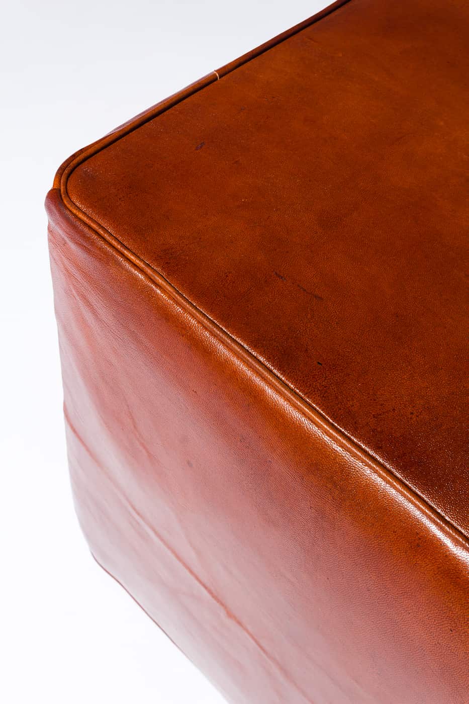 SG052 Cognac Leather Ottoman Prop Rental | ACME Brooklyn